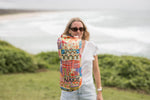 Retro Shores sustainable down puffy blanket with multicolored geometric and seaside-inspired pattern, rolled display. preview #4